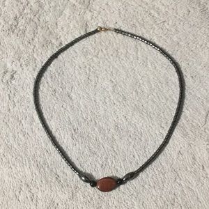 Necklace, silver with tiger eye looking stone